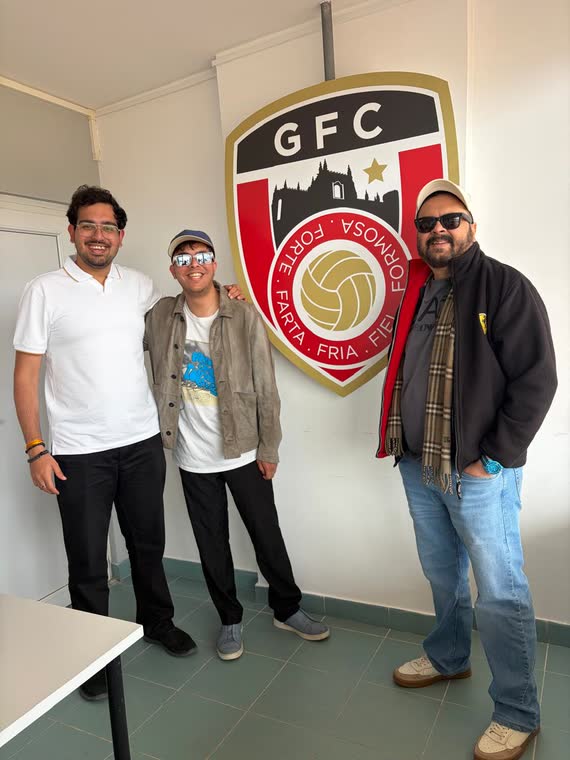 Jai Agarwal with two others beside the Guarda FC crest