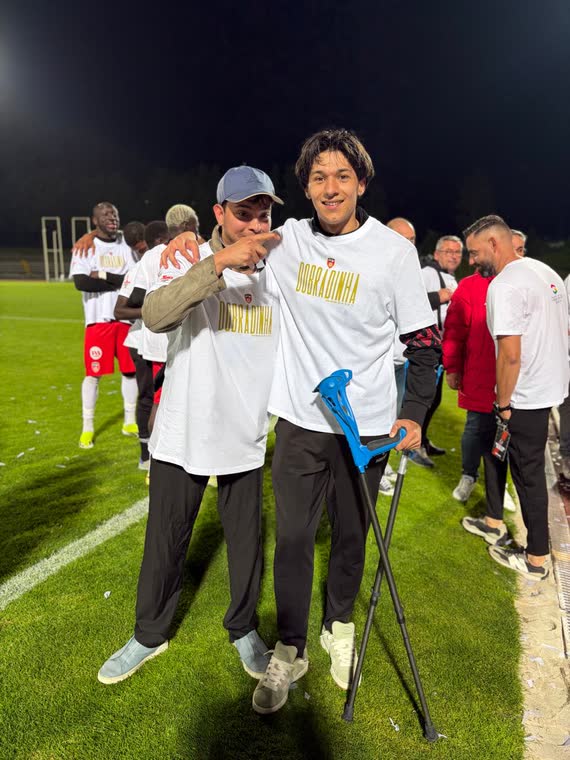 Jai Agarwal celebrating on the pitch with a Guarda FC player
